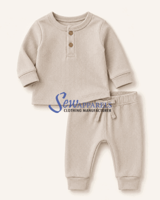Cream baby clothing set with a button-front top and matching trousers