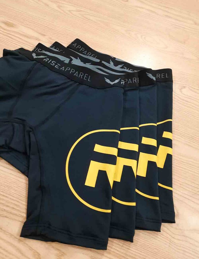 Cycling shorts with contrasting printed details laid out together